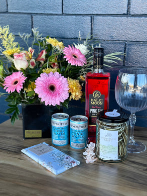 Kalki Moon Pink Gin Hamper with flowers, chocolate, dried limes, tonic water and gin glass
